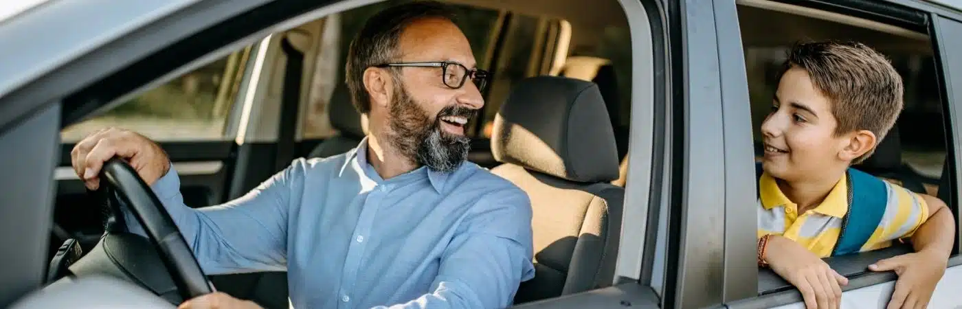 Men in his car with a vehicle title